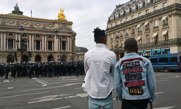 Police officers stand guard on the Opera square in Paris after the concert of Congolese artist Heritier Watanabe was cancelled on Saturday-  Gersende RAMBOURG / AFP