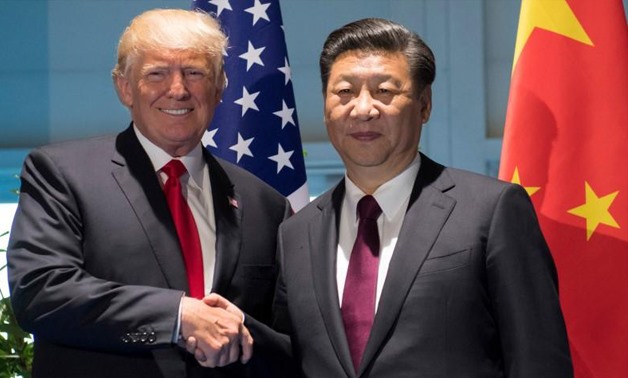 U.S. President Donald Trump and Chinese President Xi Jinping (R) shake hands prior to a meeting on the sidelines of the G20 Summit in Hamburg, Germany, July 8, 2017.
