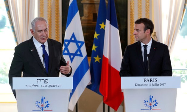French President Emmanuel Macron and Israeli Prime Minister Benjamin Netanyahu attend a news conference to make a joint declaration at the Elysee Palace in Paris - Reuters