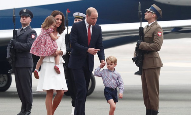 Prince William, the Duke of Cambridge, his wife Catherine, The Duchess of Cambridge, Prince George and Princess Charlotte arrive at a military airport in Warsaw, Poland July 17, 2017. REUTERS
