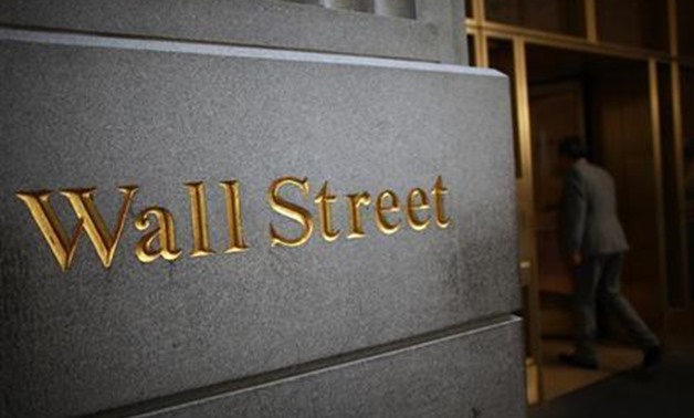A sign is seen on Wall Street near the New York Stock Exchange June 15, 2012.