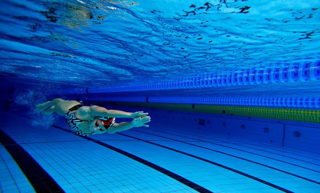 File - Hungarian swimmer Hosszu propels herself underwater at a training session in Budapest