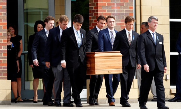 The casket of Otto Warmbier is carried to the hearse followed by his family and friends after a funeral service for Warmbier, who died after his release from North Korea, at Wyoming High School in Wyoming, Ohio, U.S. June 22, 2017. REUTERS