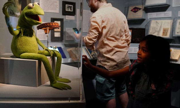 A child looks at a display of Jim Henson's Muppets character Kermit the Frog at the Museum of the Moving Image in the Queens borough of New York City, New York, U.S. July 21, 2017.
Carlo Allegri