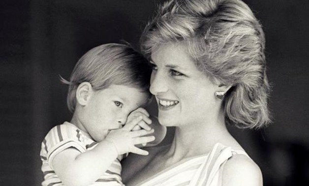 Britain's Princess Diana holds Prince Harry during a morning picture session at Marivent Palace, where the Prince and Princess of Wales are holidaying as guests of King Juan Carlos and Queen Sofia, in Mallorca, Spain August 9, 1988. - Reuters