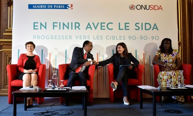© Alain Jocard, AFP | French Ambassador in charge of the struggle against HIV Michèle Boccoz, Director of UNAIDS Michel Sidibe, Mayor of Paris Anne Hidalgo and Burkinabe militant Christine Kafondo at a press conference to present UNDAIDS's latest figures.