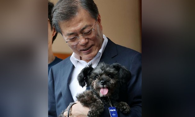South Korean President Moon Jae-in welcomes a rescue dog to his official Blue House residence in Seoul, South Korea July 26, 2017. The Presidential Blue House/Handout via REUTERS