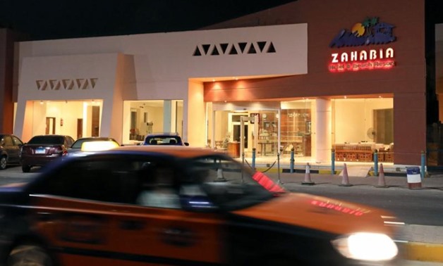 A car drives past the Zahabia hotel, where an Egyptian man stabbed two German tourists to death and wounded four others, in Hurghada, Egypt, July 15, 2017.
