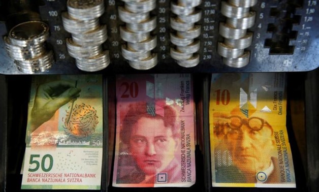 The new 50 Swiss Franc note is seen at a market stall after its release by the Swiss National Bank (SNB) in Bern - Reuters