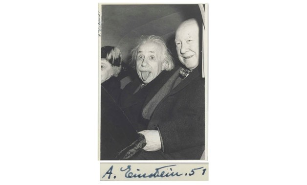 Einstein sticks his tongue out at photographer Arthur Sasse Photograph- Arthur Sasse -Nate D Sanders Auctions