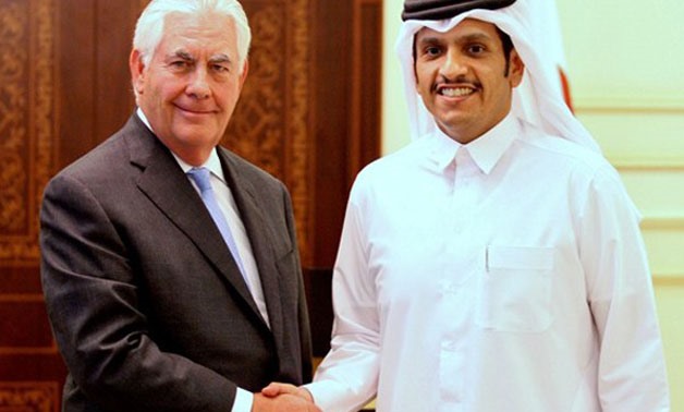 Qatar's foreign minister Sheikh Mohammed bin Abdulrahman Al Thani (R) shakes hands with U.S. Secretary of State Rex Tillerson following a joint news conference in Doha, Qatar, July 11, 2017 REUTERS/Naseem Zeitoon