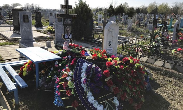 A view shows the grave of Russian military contractor Vladimir Plutinsky, who was killed in Syria according to an official document, at a cemetery in the town of Kropotkin, Russia, April 13, 2017. Picture taken April 13, 2017.
