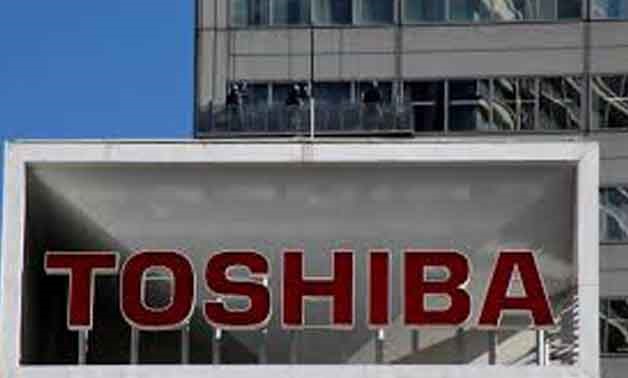 FILE PHOTO: The logo of Toshiba Corp is seen as window cleaners work on the company's headquarters in Tokyo, Japan, February 14, 2017.
Toru Hanai