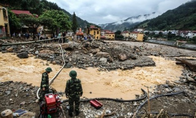 © AFP | In Vietnam's Yen Bai province floods tore through villages on Thursday night, carrying with them large boulders from mountains
