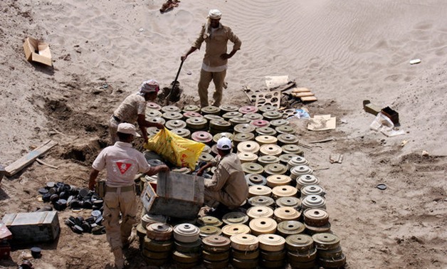 Members of a Yemeni military demining unit prepare to destroy unexploded bombs and mines collected from conflict areas near the southern port city of Aden, Yemen - REUTERS