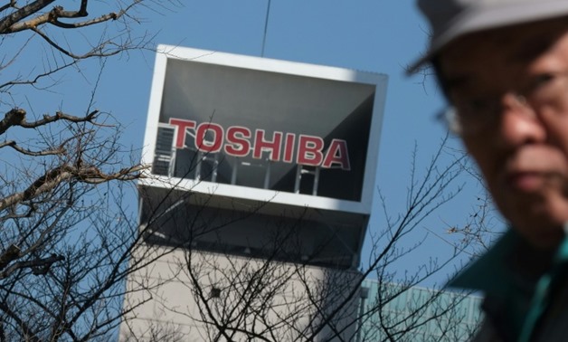 Toshiba now faces a court battle to sell off its prized memory chip business for around $18 billion -- a sale seen as crucial to its turnaround - AFP