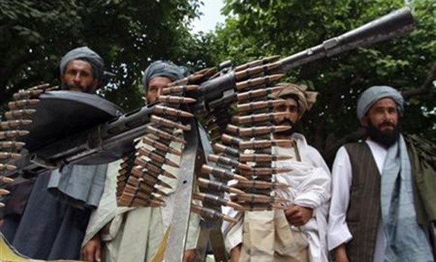 Taliban militants hand over their weapons after joining the Afghan government's reconciliation and reintegration program, in Herat province May 14, 2012 - REUTERS