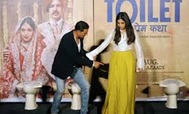 Akshay Kumar (L) and Bhumi Pednekar star in 'Toilet: Ek Prem Katha' ('Toilet: A Love Story') which is inspired by the true-life tale of one man's battle to build toilets in his village in rural India - AFP