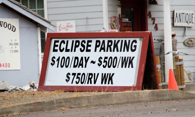 A parking sign for people visiting for the Solar Eclipse is shown in Depoe Bay, Oregon, U.S. August 9, 2017. Picture taken August 9, 2017.Jane Ross
