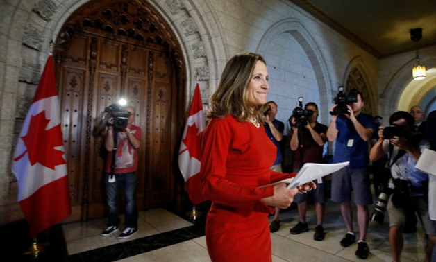 Canada's Foreign Minister Freeland arrives to speak to journalists on Parliament Hill in Ottawa - REUTERS