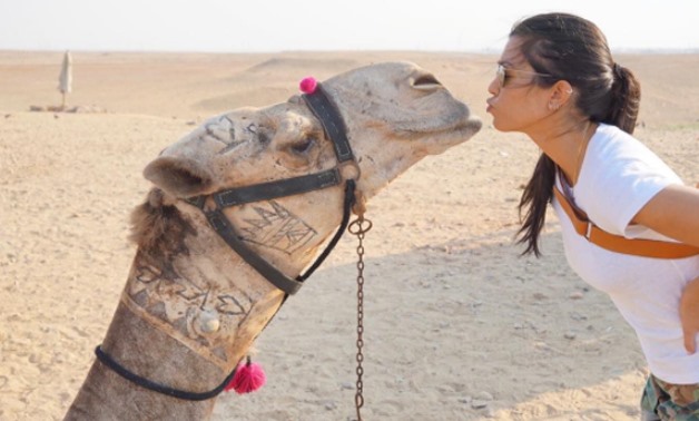 Kourtney Kardashian puckers up for a camel kiss at the Pyramids - Kourtney's official instagram