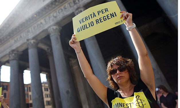 An Amnesty International activist holds a placard reading "truth for Giulio Regeni" in Rome last month. REUTERS