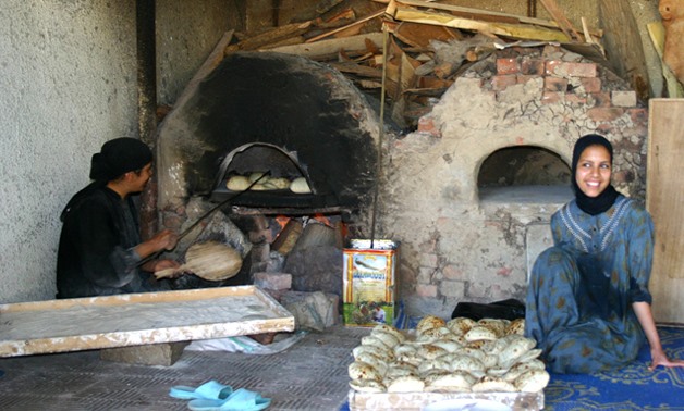  Egyptian women making bread- via Wikimedia Commons