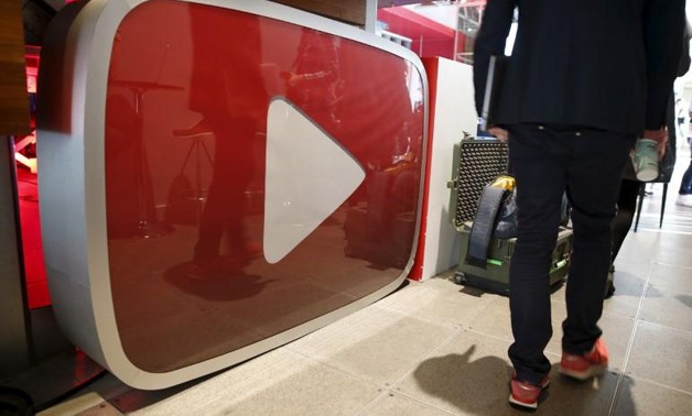 A man walks past a YouTube logo at the YouTube Space LA in Playa Del Rey, Los Angeles, California, United States October 21, 2015.
Lucy Nicholson