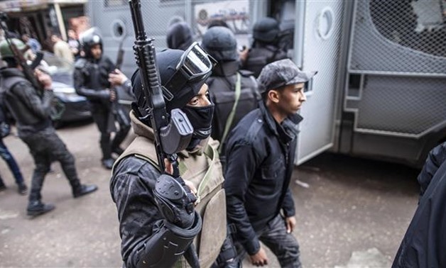 Egyptian police forces patrol streets in the southern Cairo district of Giza - File photo