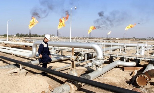 A worker walks at Nahr Bin Umar oil field, north of Basra, Iraq December 21, 2015.Essam Al-Sudani
