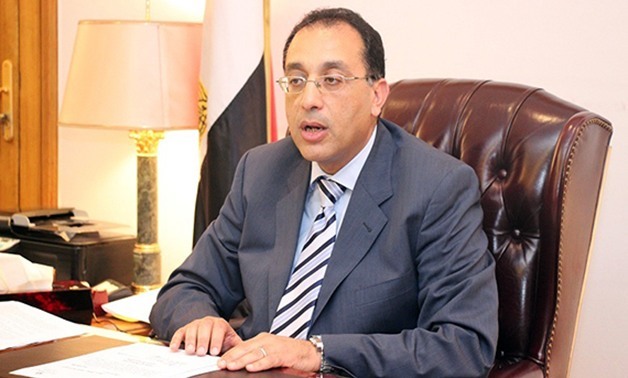 FILE - Prime Minister Moustafa Madbouli and Housing, Utilities and Urban Development Minister Moustafa Madbouli