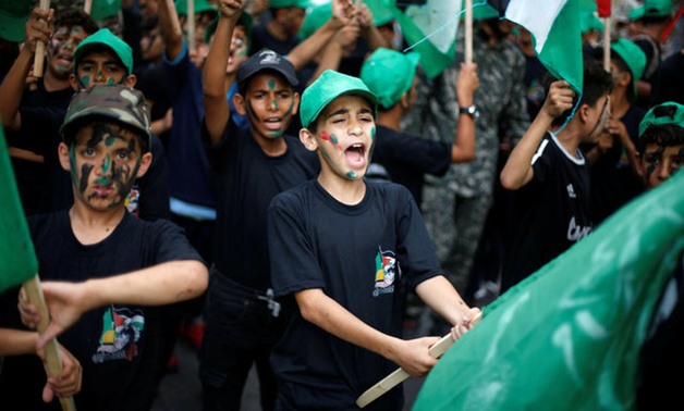 Young Palestinians chant slogans during a Hamas rally to show solidarity with Al-Aqsa mosque, in Gaza City -REUTERS