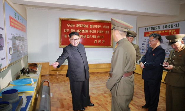 North Korean leader Kim Jong-Un gives field guidance during a visit to the Chemical Material Institute of the Academy of Defense Science in this undated photo. KCNA/via REUTERS
