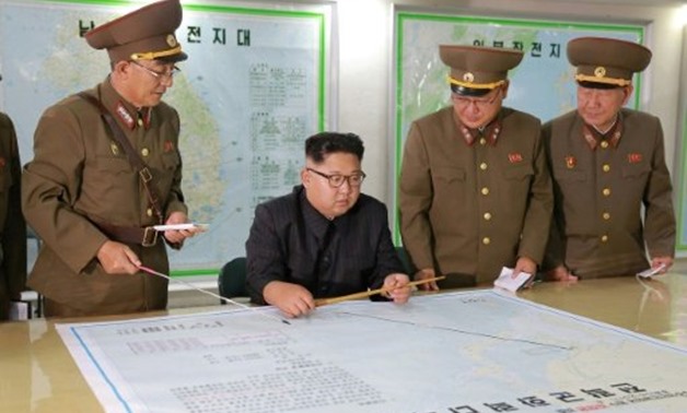 © KCNA VIA KNS/AFP/File | This picture taken August 14, 2017 and released by North Korea's Korean Central News Agency August 15, 2017 shows North Korean leader Kim Jong-Un (C) inspecting the Command of the Strategic Force of the Korean People's Army at an