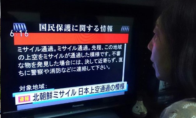 Japan's "J-alert" delivered ominous messages warning people to take cover after North Korea fired a missile over the north of the country AFP / by Hiroshi HIYAMA |
