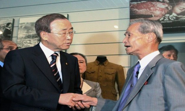 Sumiteru Taniguchi (R) with the then-United Nations Secretary-General Ban Ki-moon in 2010  JIJI PRESS/AFP/File 