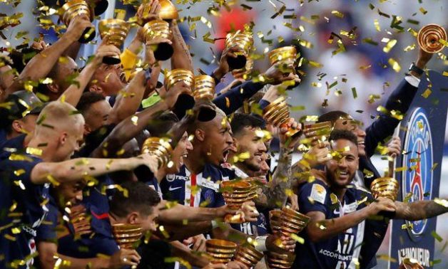 Paris St Germain players celebrate the title, Reuters 
