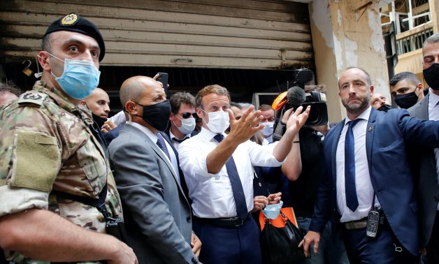 French President Emmanuel Macron gestures as he visits a devastated street of Beirut, Lebanon August 6, 2020. Thibault Camus/Pool via REUTERS