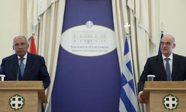 FILE - Greek Foreign Minister Nikos Dendias addresses journalists during a joint press conference with his Egyptian counterpart, July 30, 2019. REUTERS