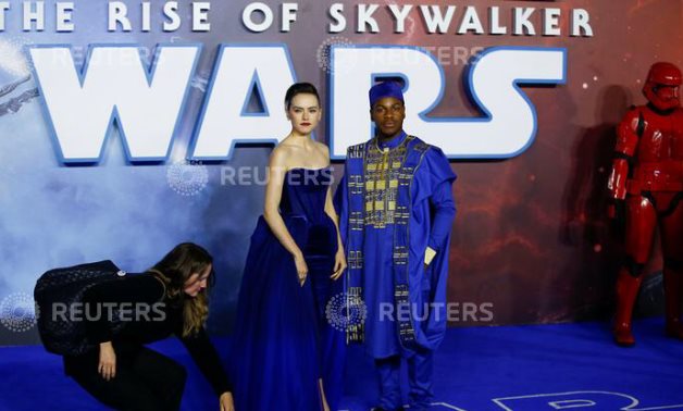 FILE PHOTO: Cast members Daisy Ridley and John Boyega pose as they attend the premiere of "Star Wars: The Rise of Skywalker" in London,REUTERS/Henry Nicholls.