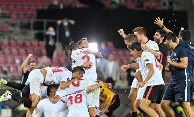 Sevilla players celebrate their victory, Reuters 