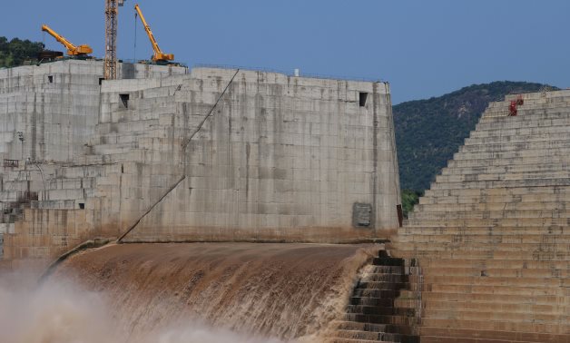 FILE PHOTO: Water flows through Ethiopia's Grand Renaissance Dam as it undergoes construction work on the river Nile in Guba Woreda, Benishangul Gumuz Region, Ethiopia, September 26, 2019. REUTERS/Tiksa Negeri/