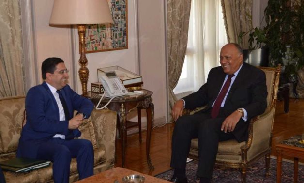 FILE - Egyptian Foreign Minister Sameh Shoukry meets with his Moroccan counterpart, Nasser Bourita (L)