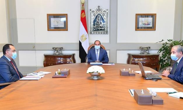 President Abdel Fattah El Sisi meets with Prime Minister Mostafa Madbouly and Minister of Supply and Internal Trade  Ali El-Meselhy on Monday- press photo