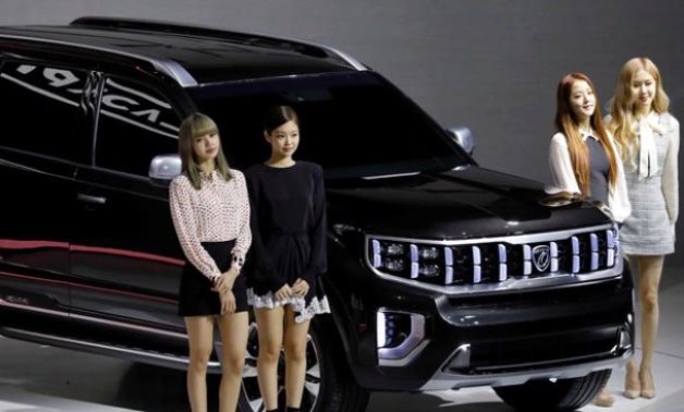 FILE PHOTO: Members of K-pop idol group Black Pink pose for photographs with Kia Motors' Mohave during the 2019 Seoul Motor Show in Goyang, South Korea, March 28, 2019. REUTERS/Kim Hong-Ji