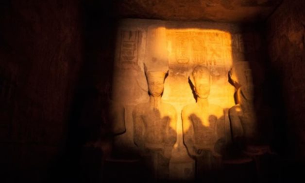 Sun illuminating on the face of Ramses II statue in Abu Simbel Temple - ET