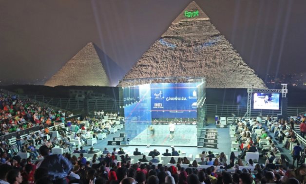 FILE - Squash tournament at the Pyramids of Giza