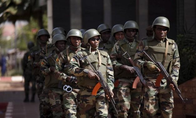 FILE - Soldiers patrol before the arrival of Mali's President Ibrahim Boubacar Keita outside the Radisson hotel in Bamako, Mali - Reuters