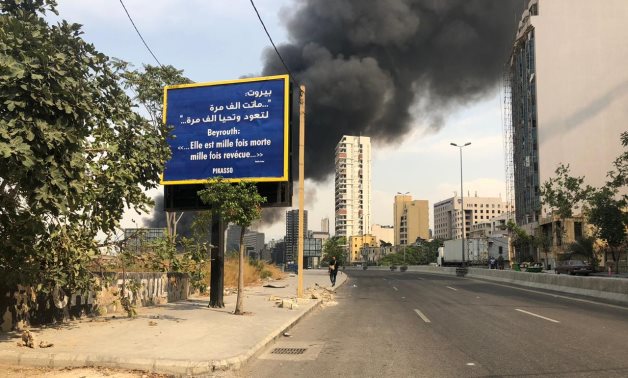 Sign in Beirut reads Beirut died thousands times to come back and live thousands times  - Photo by Journalist Eman Hanna/Egypt Today 