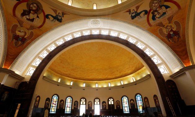 Workers clean the interior of the new Coptic Cathedral "The Nativity of Christ" before Sunday's Coptic Christmas Eve Mass in the New Administrative Capital (NAC) east of Cairo, Egypt January 3, 2019 - Reuters